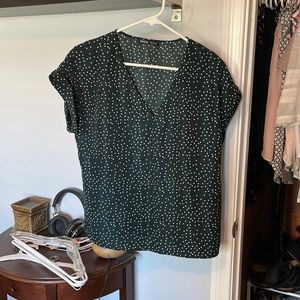 Navy blue blouse with white polka dots.
